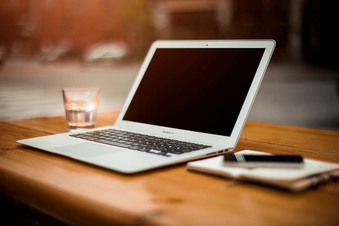 Developer Notebook - MacBook Air on a wooden Table